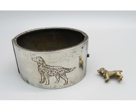 A wide hallmarked silver bangle engraved with red setter dog detail and a silver dog brooch, Birmingham 1933 and 2002 