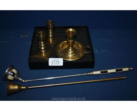 A long armed Candle Snuffer possibly Masonic, a pillar candlestick and three other smaller Candlesticks