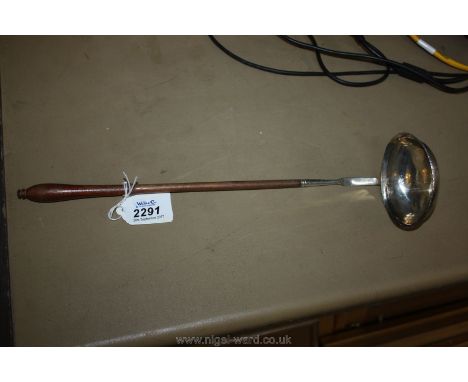 A wooden handled white metal Toddy Ladle