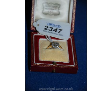 A pretty Art Deco circular diamond ring (no mark visible)