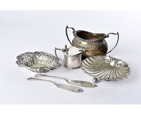 A Victorian silver shell shaped butter dish and knife, together with a silver sugar basin, a silver mustard pot with plated s