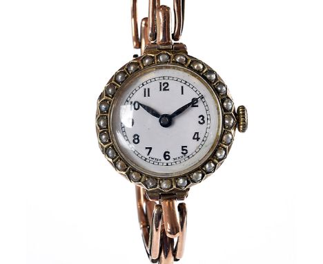 An early 20th century 9ct gold Buren ladies wristwatch, having pearl bezel, on a 9ct gold expanding strap, 21.8g 