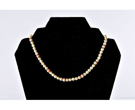A modern suite of pearl and coral jewellery, comprising necklace and bracelet with 9ct gold clasps which can be worn as one, 