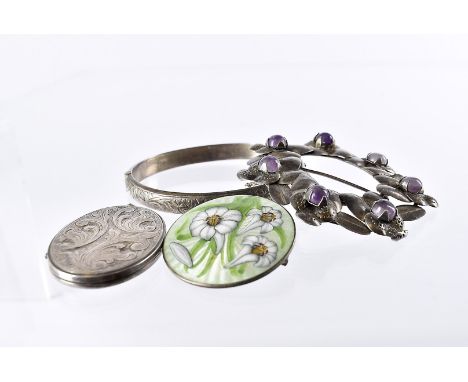 A modern silver and enamel lily brooch, together with a silver locket pendant, bangle and Mexican silver wreath brooch (4) 