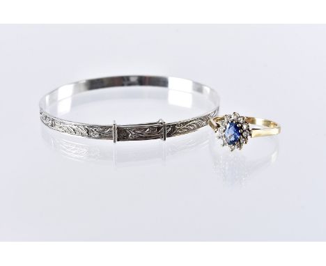 A modern 9ct gold sapphire and diamond ring, oval blue stone with brilliant cuts surround, 2.2g and size N, together with a s