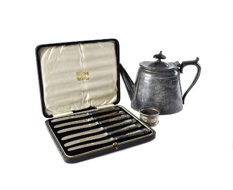 A collection of silver plated flatware and other items, including a set of boxed silver handled butter knives, a silver napki