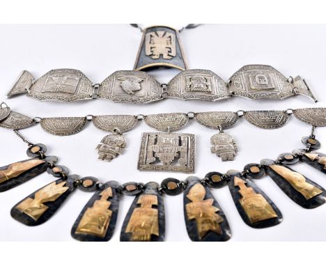 A group of eight Peruvian silver and white metal jewellery items, including two pairs of cufflinks, three necklaces, two brac