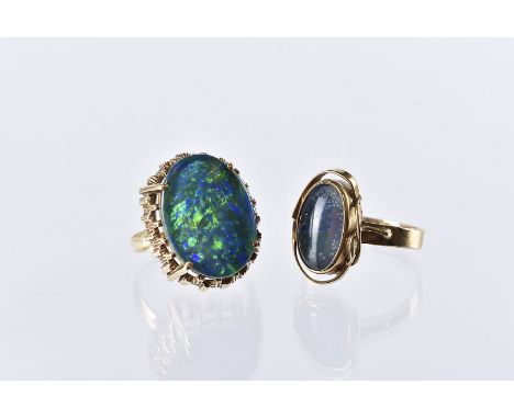 Two yellow metal and opal dress rings, both with Australian opals, the larger example with retro mount, 7.8g (2) 