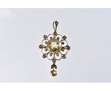 An Edwardian citrine and seed pearl pendant cum brooch, marked 9ct, with large central stone and drop 