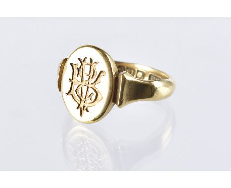 A Victorian 18ct gold signet ring, with monogram tablet, 7.5g and size R 