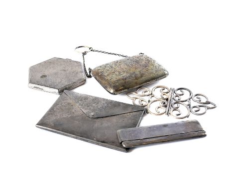 Five Victorian and later items of ladies silver, including an envelope shaped calling card case, a purse, a comb, a nurses be