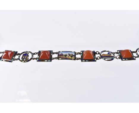 A vintage Egyptian silver and enamel bracelet, four square panels with orange glass and other panels with scene of pyramids, 