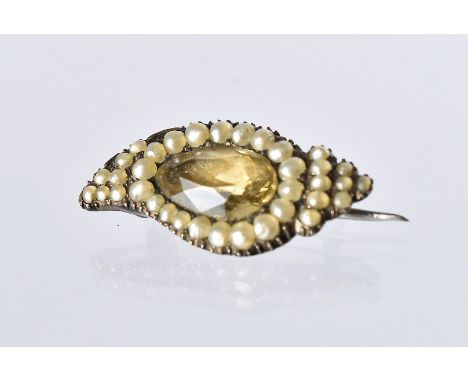 An early 19th century seed pearl and paste brooch, in the form of an eye with gold backing, 2.5cm wide 