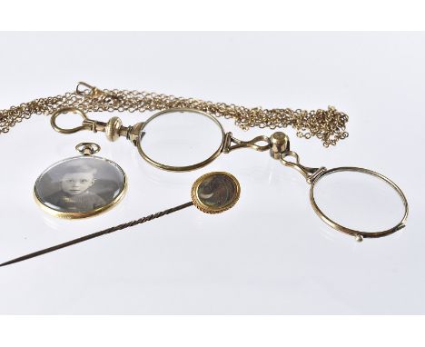 A Victorian pair of gilt lorgnettes, together with a Victorian mourning stick pin, a locket pendant and gold plated muff chai