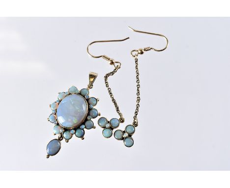 A vintage 9ct gold and opal pendant and earring suite, the drop earrings with three round opals on chain with hooks, the pend