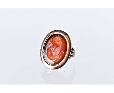 A 19th century carnelian seal signet ring, having an intaglio bust of a lady in possibly gold oval mount, 6g and size i 