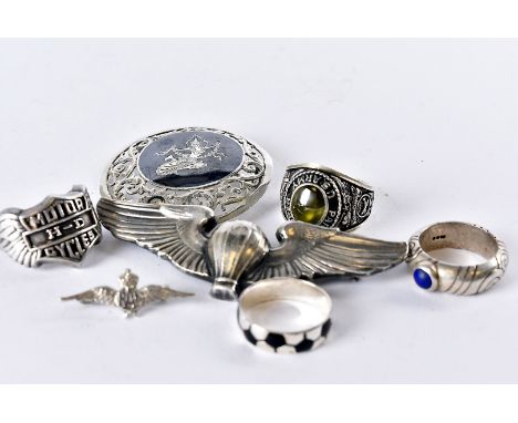 Seven silver and white metal items of jewellery, including a US Paratrooper / Marine style brooch and ring, an RAF brooch, a 