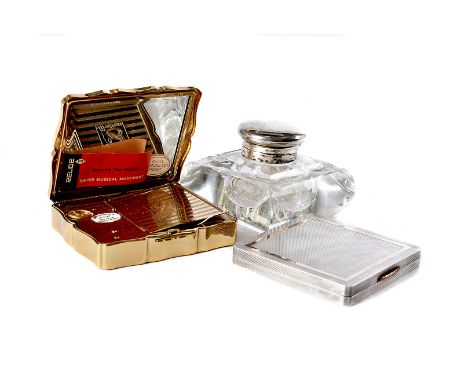 A 1940s silver and 9ct gold inlaid compact, Birmingham 1949, together with a Stratton compact and a glass and silver mounted 