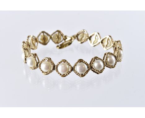 A modern 9ct gold and pearl line bracelet, diamond shaped links set with half cut white pearls, hallmarked, 17g 