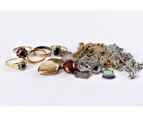 A group of five gold rings and other jewellery, including a 22ct gold band, 2g, an 18ct gold and garnet ring, 4g, two 9ct gol