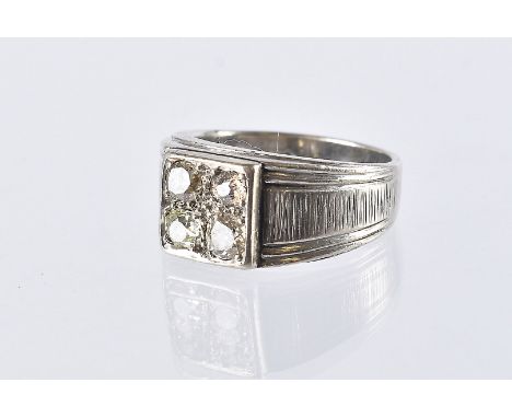 A vintage diamond dress ring, the white metal mount marked 18K having a tablet set with four old and round cut stones, 6.3g a