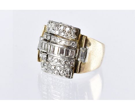An Art Deco and later diamond dress ring, the large white metal tablet set of with approx 3ct of brilliant and baguette cuts,