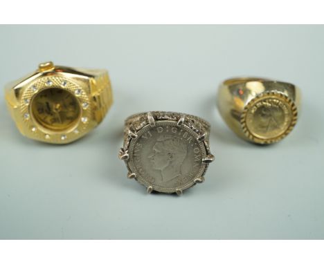 A vintage 3d coin ring, the mount / shank stamped "silver", together with one other coin ring and a Japanese watch ring