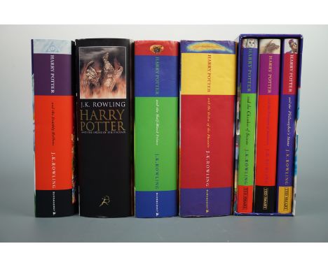 Four J K Rowling first edition Harry Potter novels together with a set of three in slip-case