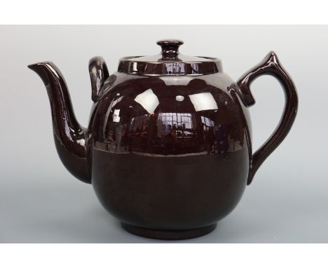 A vintage large treacle-glazed fireproof ceramic teapot