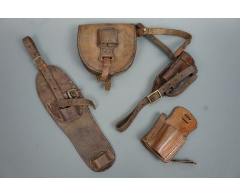 Thee various Great War and Second World War British army cavalry saddlery sword frogs and a horseshoe pouch / sword frog