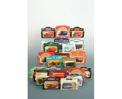 Twenty one boxed die-cast cars and vans including In London Fire Brigade Engine and Royal Mail wagon etc.