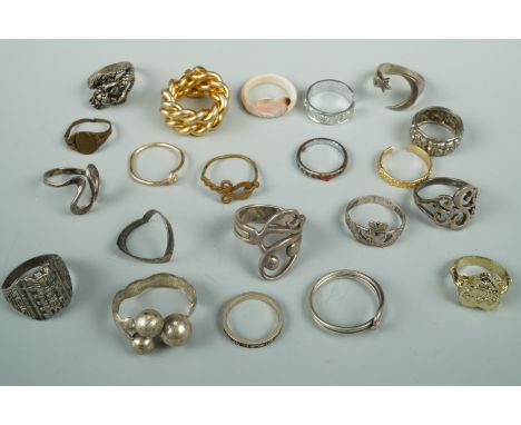 Silver and other finger rings including a claddagh and a white metal crescent and star ring