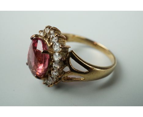 A contemporary lotus pink tourmaline and white topaz dress ring, in a flower head cluster setting, on 9ct gold, size N 1/2, w