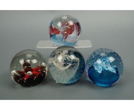 Four Caithness paperweights including Moonflower and Splash Down
