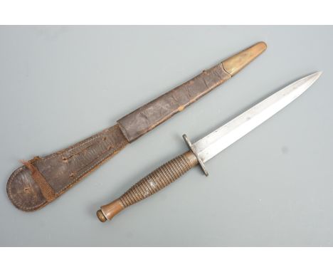 A Second World War British military third pattern FS / Fairbairn Sykes fighting knife, the grip bearing a mould mark 4 and st