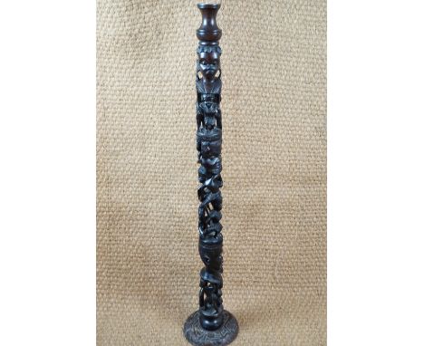 A large African sectional carved hardwood lamp base, 117 cm