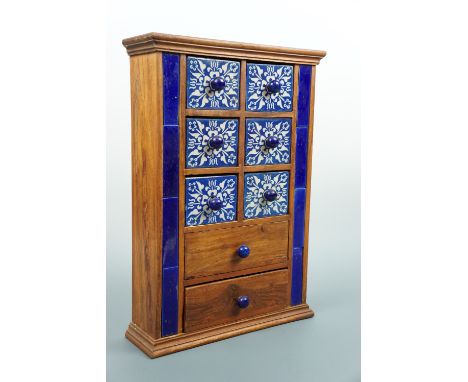 A small spice chest with ceramic and wooden drawers, 31 × 10 × 45 cm