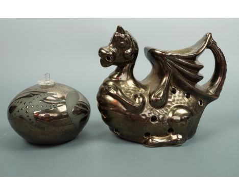 A Neville Green bronze lustre ceramic perfume bottle, together with a tea light holder modelled as a dragon