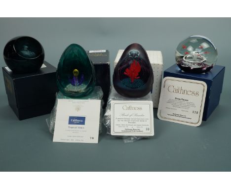 Four Caithness paperweights: Sanctuary, Snow Flower, Birds Of Paradise, and Tropical Vision