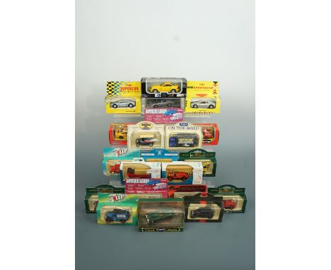 Twenty four boxed die-cast cars and vans including a Kellogg's Rice Krispies bus and Brasso van etc.