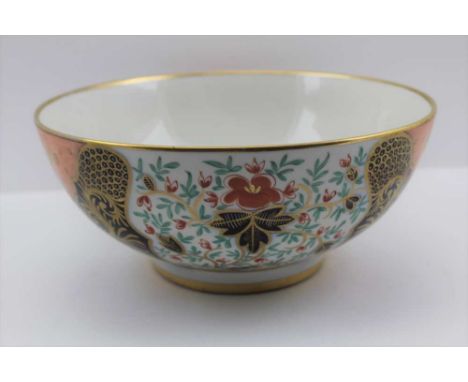 A CERAMIC BOWL gilded and painted in the Imari palette, stylised floral decoration, 25cm in diameter 