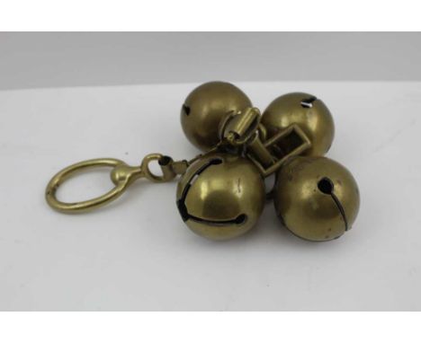 A COLLECTION OF FOUR 19TH CENTURY BRASS "VICTORIA" HORSE SLEIGH BELLS, on brass chain with securing ring, each bell inscribed