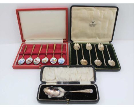 A CASED SET OF SILVER GILT &amp; ENAMEL COLLECTOR'S SPOONS, floral decoration, Birmingham 1954, together with a cased set of 