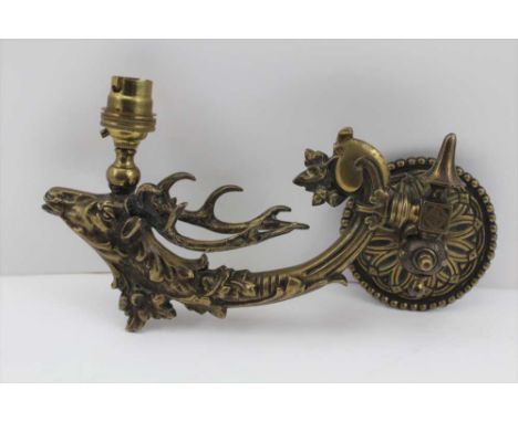 A 19TH CENTURY CAST BRASS GAS LIGHT FITTING, of stag mask design (later electric light fitting), 28cm from back plate to stag