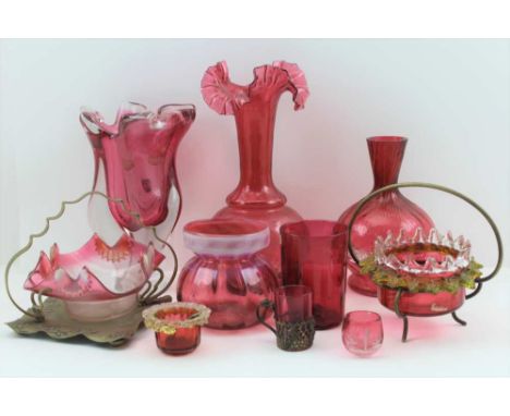 A QUANTITY OF CRANBERRY GLASSWARES, to include; a fluted rim vase 26cm high, an amorphous form cranberry &amp; clear glass va