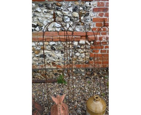A pair of wide weathered steel medium arrow head obelisks , 129 cm high x 44 cm diam (2)