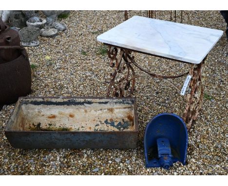 A wrought iron small garden table with alabaster top to/w a cast iron feed trough and a cast iron drinker (3)