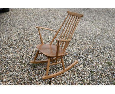 A mid-century Ercol spindle back rocking chair