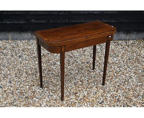 &nbsp;A 19th century mahogany and rosewood crossbanded folding tea/card table raised on tapering square supports, 92 cm wide 