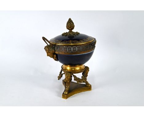 A 19th century Continental large ormolu and porcelain pot pourri bowl and cover with gros bleu glazed ceramic, the gilt metal